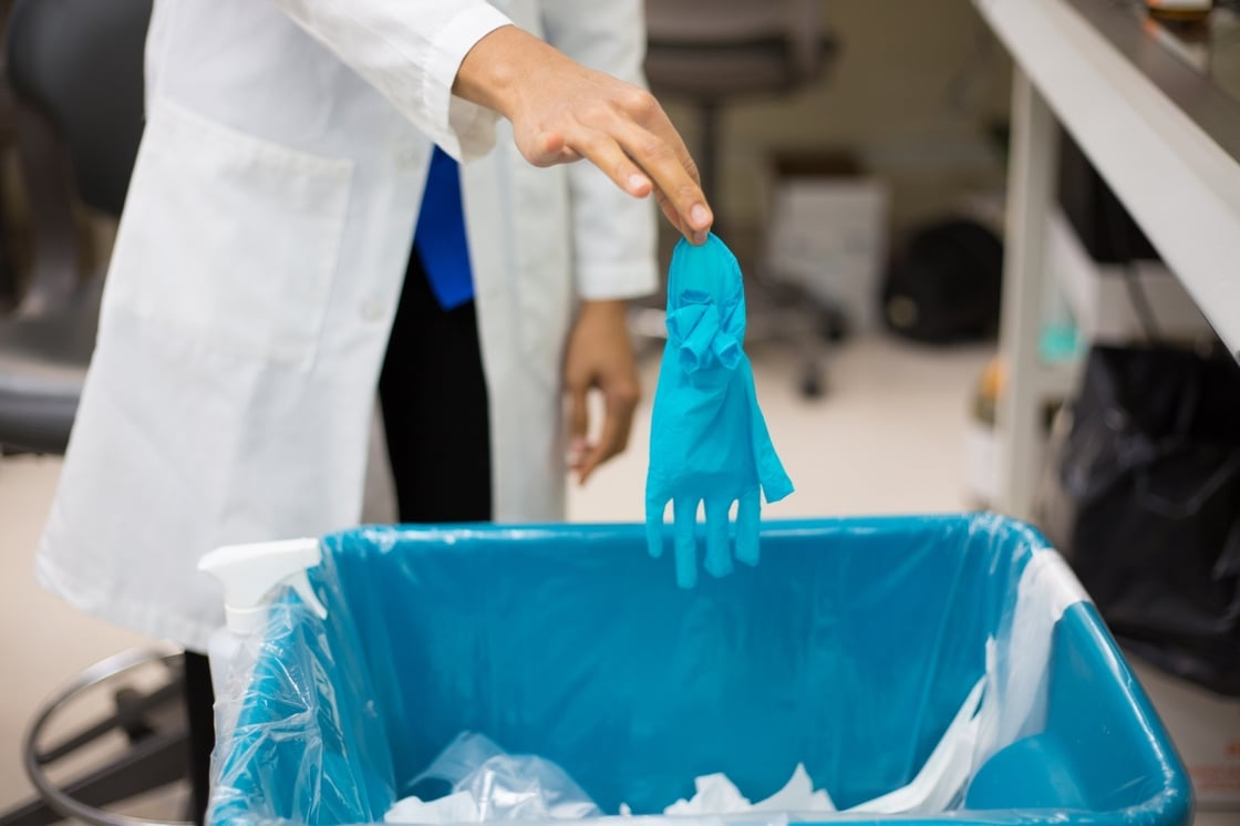 AdobeStock_waste-glove-trash-disposal-scaled-1440x960